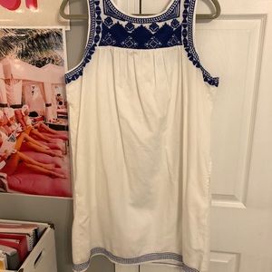 White dress with blue embroidery
